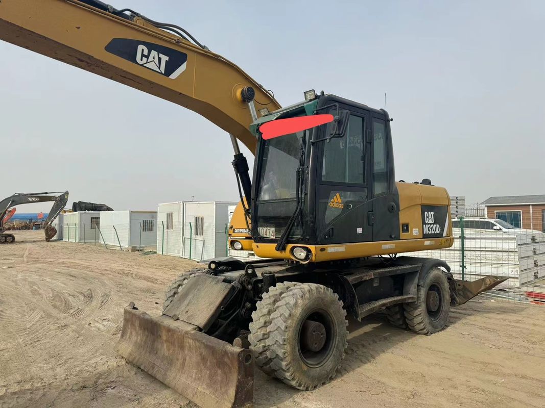 90% Caterpillar M317D2 Χρησιμοποιούμενος εξορυκτής τροχών υψηλής ποιότητας και καλύτερης απόδοσης προς πώληση